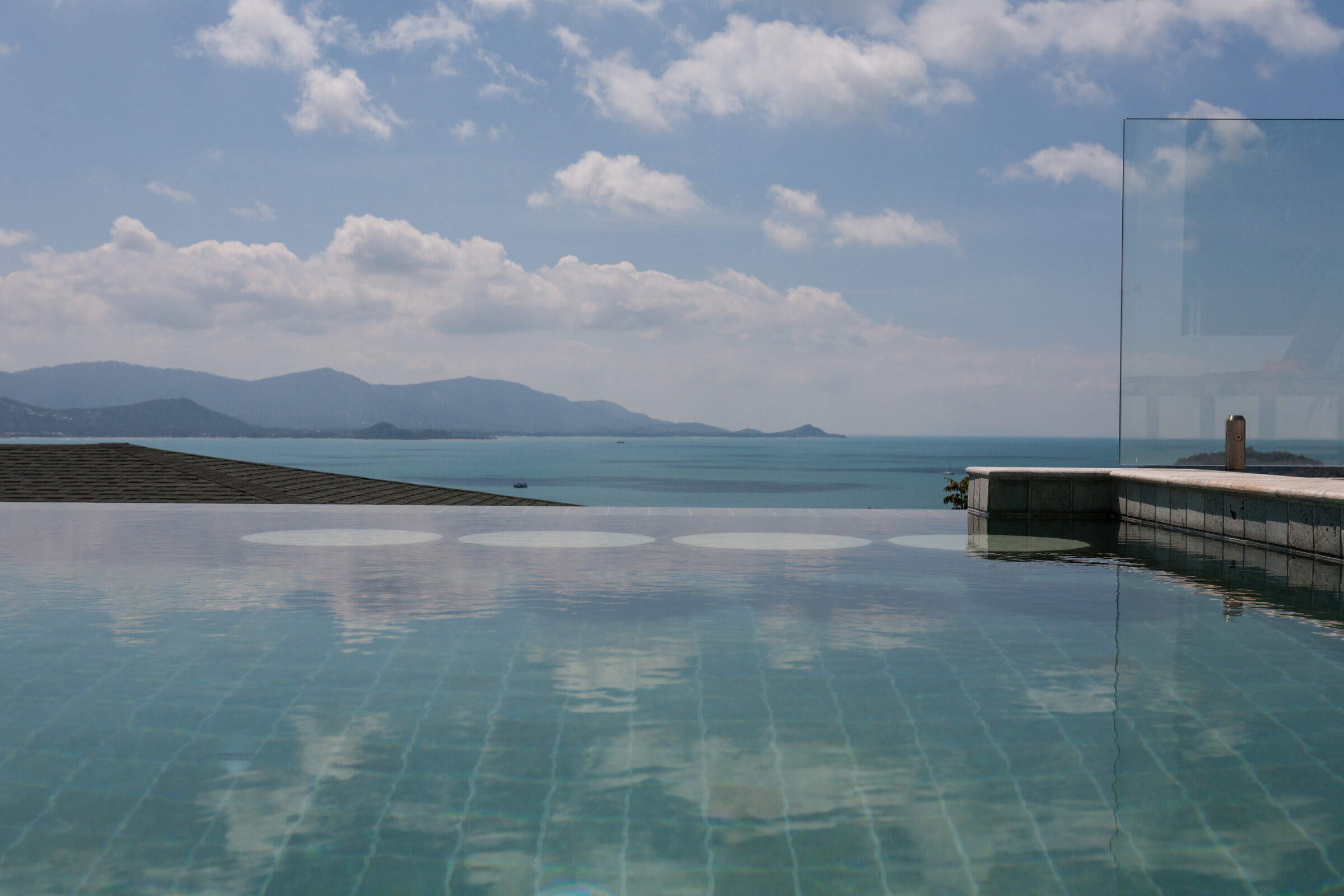 Villa Daizo infinity pool daytime with crystal clear ocean views